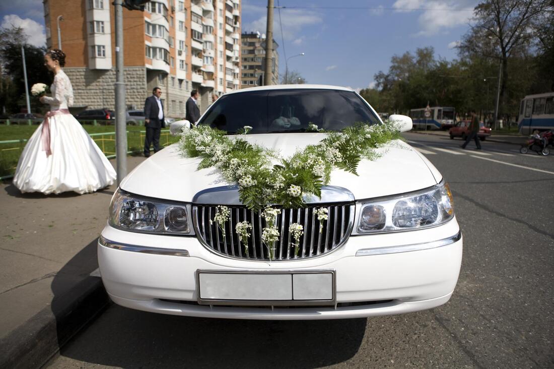limousine with flowers in front